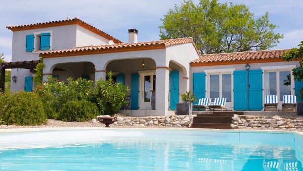A two-story house with a swimming pool, blue shutters, and a stone wall. - Stylish Family Villa in Felines (Boutenac)