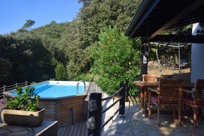 A wooden deck with a hot tub, outdoor seating, and a pool. - Escape in Duniere-sur-eyrieux (Duniere-sur-Eyrieux)