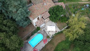 An aerial view of a property with a swimming pool, a stone house, and surrounding greenery. - Escape in Duniere-sur-eyrieux (Duniere-sur-Eyrieux)