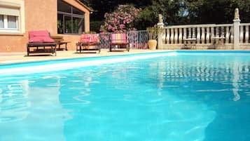 Seasonal outdoor pool, pool loungers