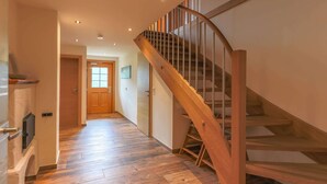 A wooden staircase with a handrail and a door at the top. - Rustic Mansion in Mittersill near Kirchberg Ski Area (Mittersill)