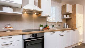 Villa | Private kitchen | Microwave, highchair