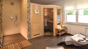 A wooden sauna room with a glass door, a wooden bench, and a small table with candles. - Ferienwohnung mit Sauna in Schonbrunn Thuringen (Schleusegrund)