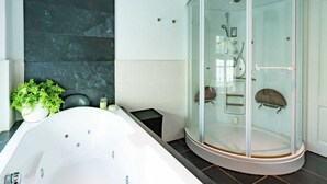 A modern bathroom with a freestanding bathtub, a glass-enclosed shower, and a potted plant. - Cottage in Ovezande With Terrace (Ovezande)