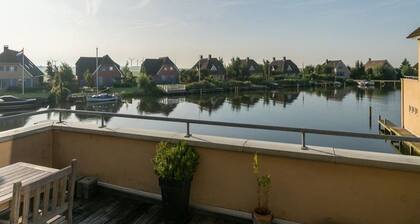 Exclusive Holiday Home Floating on a Lake in Friesland