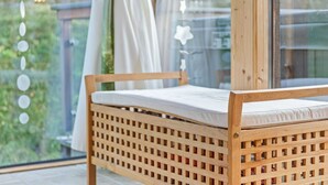 A wooden bed with a slatted headboard, a white mattress, and a view of greenery through a window. - Spacious Holiday Home in Styria near Kreischberg Ski Area (Sankt Georgen am Kreischberg)