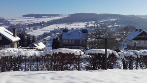 A snow-covered landscape with houses and a clear sky. - Holiday Home in Stavelot Near Tennis Court (Stavelot)
