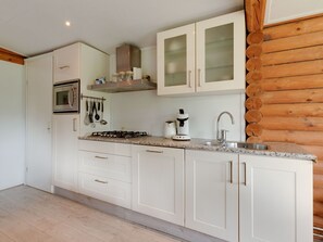 Private kitchen - Wooden Tree Trunk Bungalow at Fish Pond (Hoge Hexel)