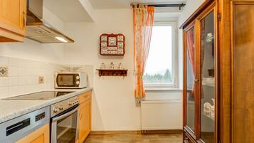 Apartment | Private kitchen | Fridge, high chair