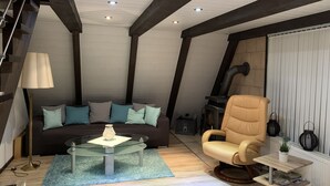 A cozy loft bedroom with a loft bed, a sofa, a glass coffee table, a leather armchair, and a fireplace. - Pure nature - forest vacation in the Tiny House (Ronshausen)