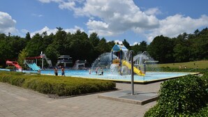 A water park with slides and a pool area. - Holiday Home in Zorgvlied Near Drents (Zorgvlied)