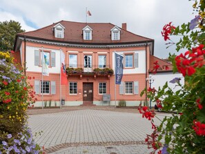 A large, historic building with a symmetrical facade, multiple windows, and a central entrance. - Spa Apartment, Bad Durrheim (Bad Duerrheim)