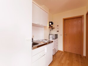 Appartement | Privékeuken | Een kinderstoel
