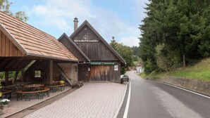 A rustic wooden building with a sign reading "Mönchhof-Säumühle". - Apartment in Waldachtal Near the Forest (Waldachtal)