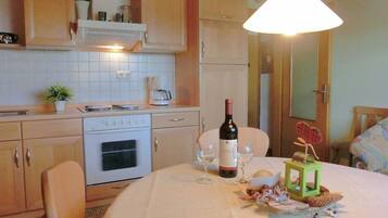 Apartment | Private kitchen | Microwave, stovetop, high chair, cookware/dishes/utensils