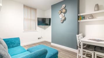 PLATFORM Avenues Apartment 1 | Living room | 42-inch flat-screen TV with digital channels, TV