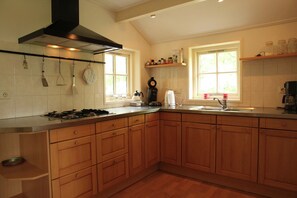 House | Private kitchen | Dishwasher, high chair - Holiday Home in Friesland Near Lake Nederhorst (Scharsterbrug)