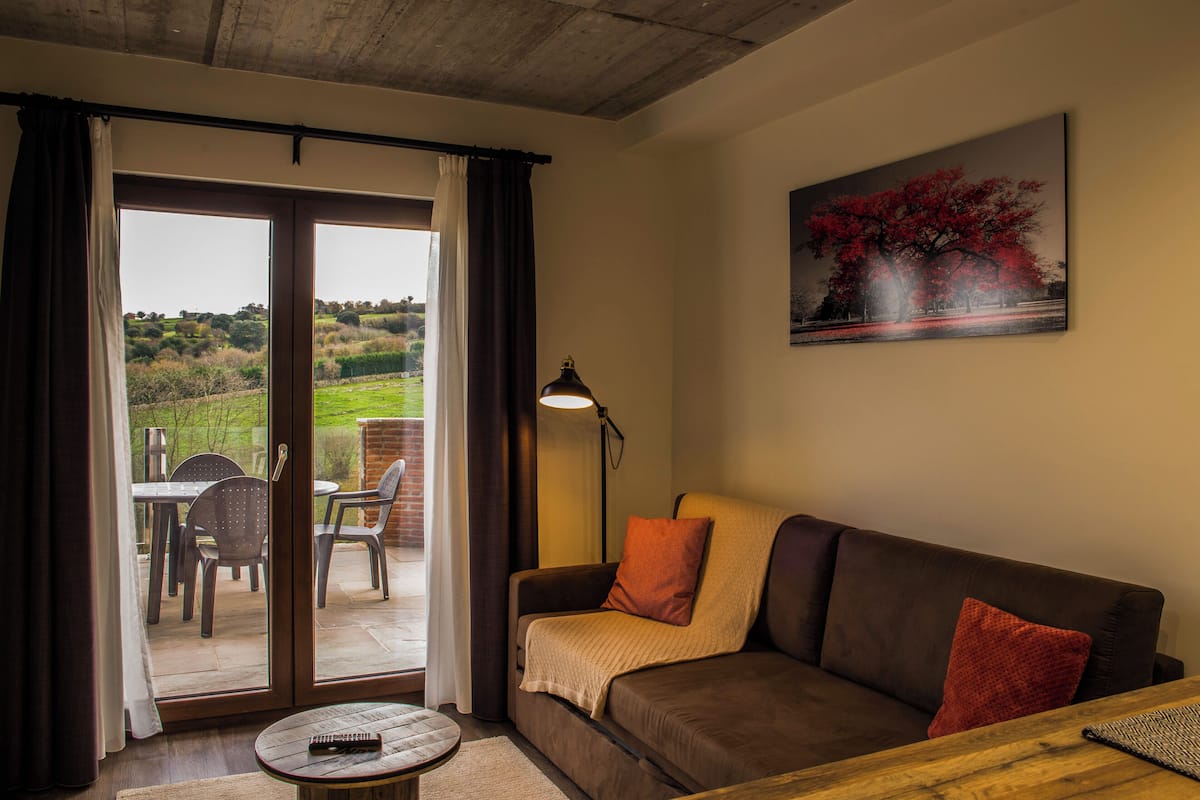 Apartment, 1 Bedroom, Terrace | Living area | Smart TV