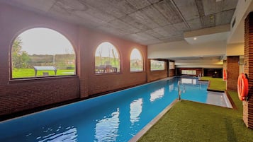 Indoor pool, seasonal outdoor pool, open noon to 8:00 PM, pool loungers