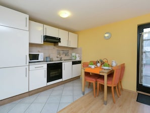 Appartement | Cuisine privée | Chaise haute