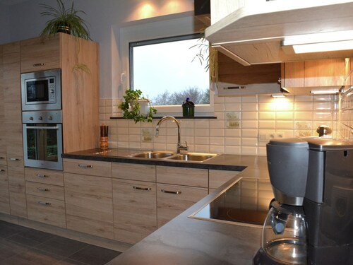 A Villa Between the Town Centre and the Forest