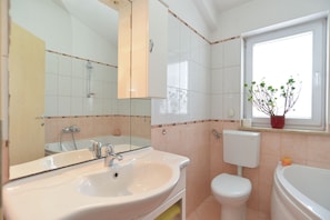 Standard Apartment, 1 Bedroom (23021) | Bathroom | Bathtub, deep soaking tub, hair dryer, towels