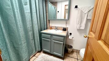 Bathtub, hair dryer, towels