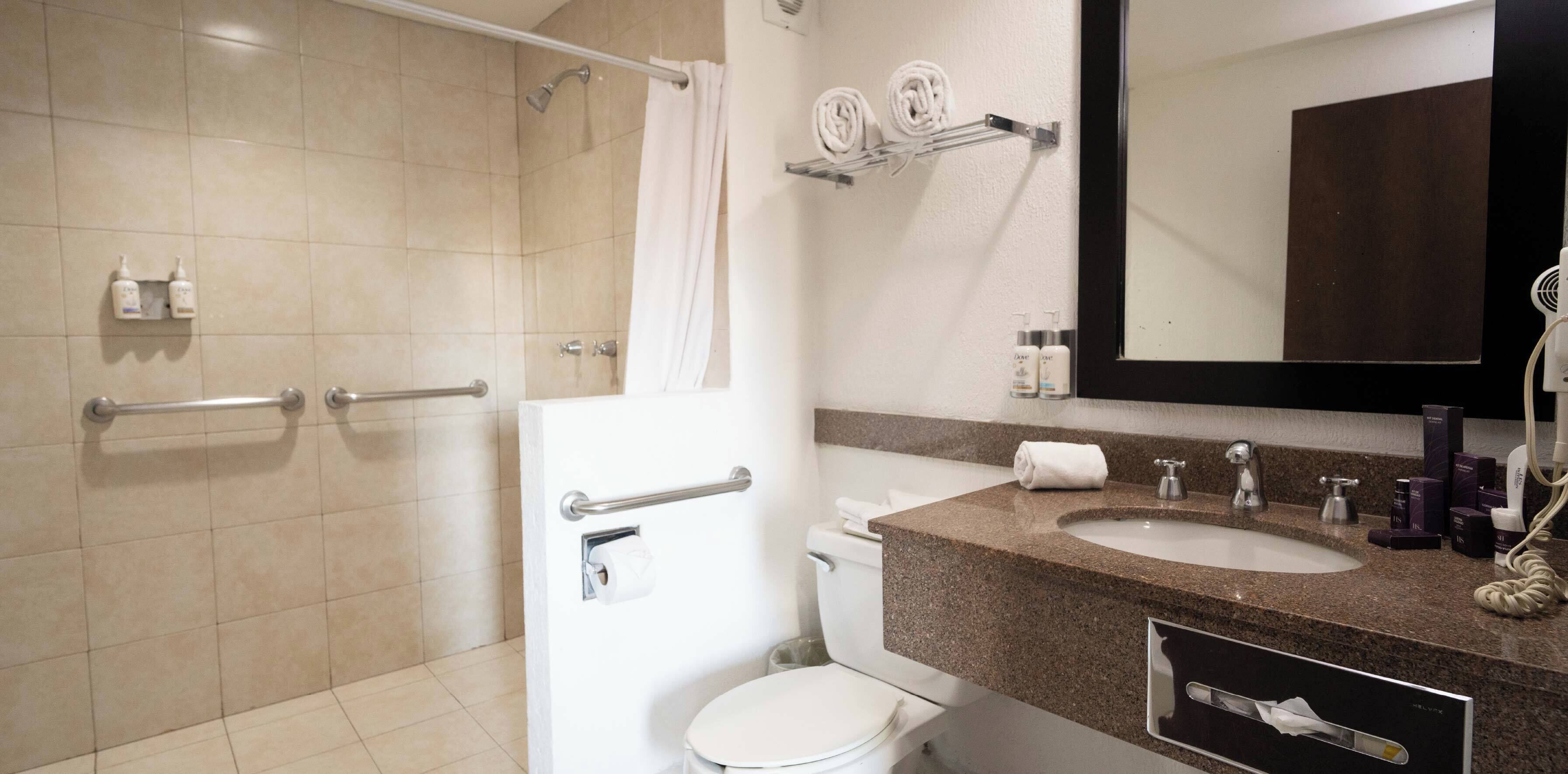 shower, rainfall showerhead, hair dryer, towels