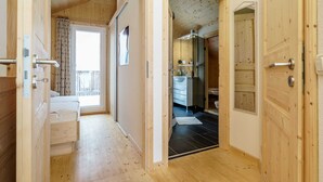 A wooden interior with a bathroom and a balcony. - Chalet in Hohentauern With Sauna Near ski Area (Hohentauern)