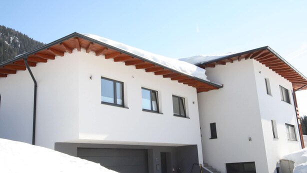 A modern two-story house with a white exterior, wooden roof beams, and a garage. - Apartment in Annaberg Near Dachstein Ski (Annaberg-Lungoetz)