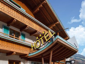 A hotel with a wooden facade, balconies, and a sign indicating the name. - Apartment in Wald Near Zillertal Ski Slopes (Wald im Pinzgau)