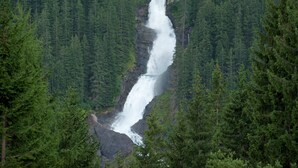 A waterfall surrounded by dense forest. - Beautiful Apartment With Large, Sunny Balcony (Hollersbach im Pinzgau)