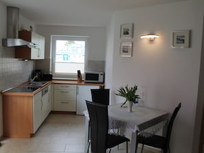 Appartement | Cuisine privée | Chaise haute