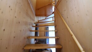 A wooden interior with a spiral staircase. - Chalet in Stadl an der Mur / Styria Near ski Area (Stadl-Predlitz)