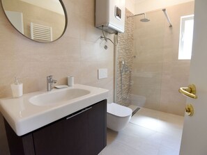 Villa | Bathroom | Bathtub, towels