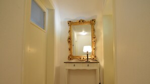 A small, white vanity with a gold-framed mirror and a single drawer. - Hellenthal Family Retreat (Hellenthal)