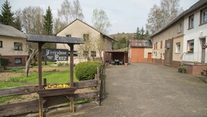 A rural building with a sign reading "Ferienhaus Laux." - Eifel Retreat Near Volcanic Lakes (Ulmen)