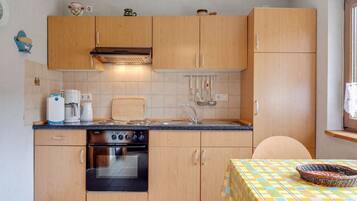 Apartment | Private kitchen | Electric kettle, highchair