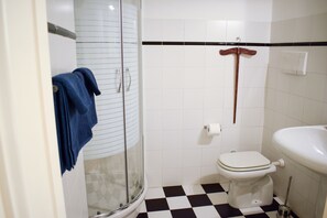 Bathtub, hair dryer, towels, soap