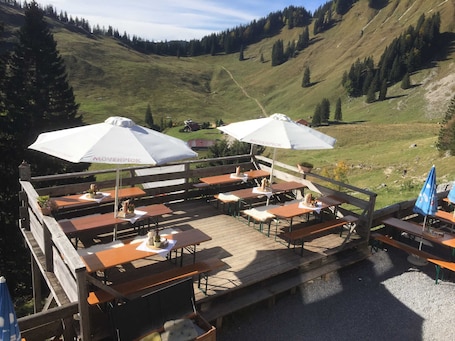 Outdoor dining. Quadruple Room - Berggasthof Obere Firstalm