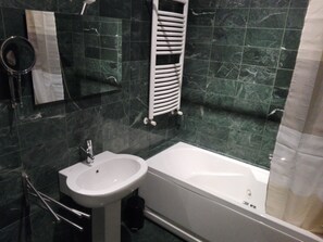 Bathtub, hair dryer, bidet, towels