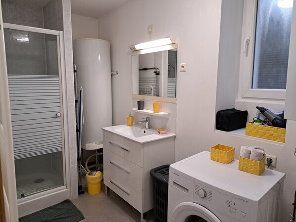Shower, hair dryer, towels, soap