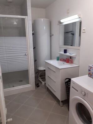Shower, hair dryer, towels, soap