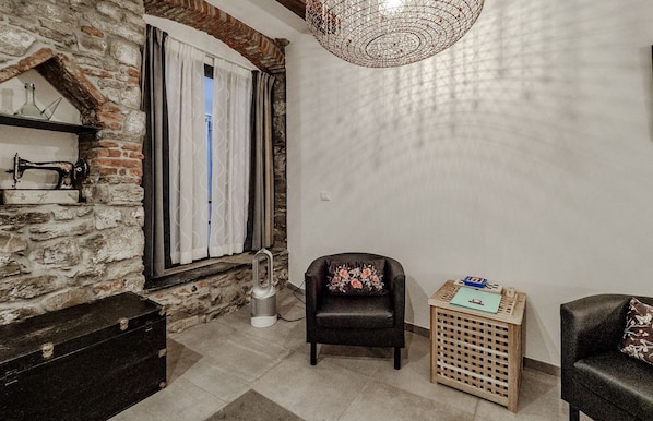 Living corner with stone wall