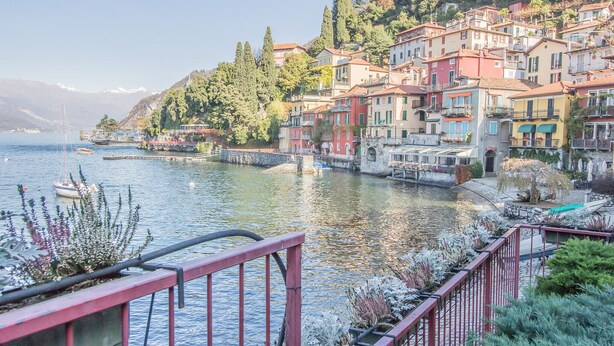 A waterfront town with colorful buildings, a dock, and a bridge. - Elizabeth House Varenna (Varenna)