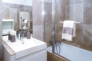 Shower, hair dryer, towels