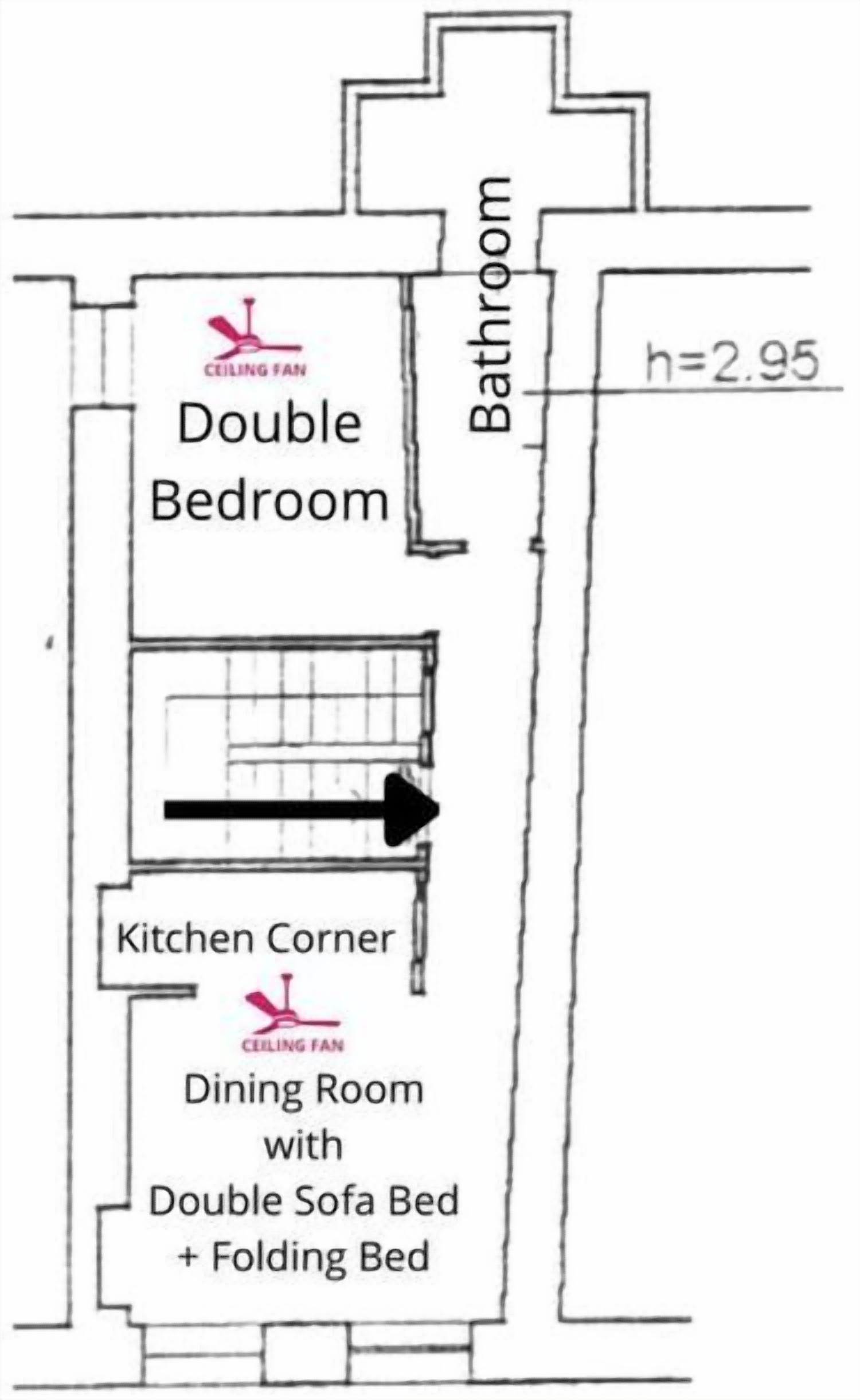 Plano de un cuarto de hotel con cama doble, baño y un rincón de cocina con comedor.