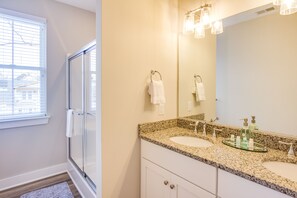 Combined shower/tub, hair dryer, towels, toilet paper