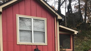 A red barn with two blue bicycles parked in front. - The Oriole, hot tub, walk or Bike to Saugatuck! (Saugatuck)