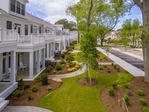 Stylish townhouses with balconies and beautifully manicured lawns.